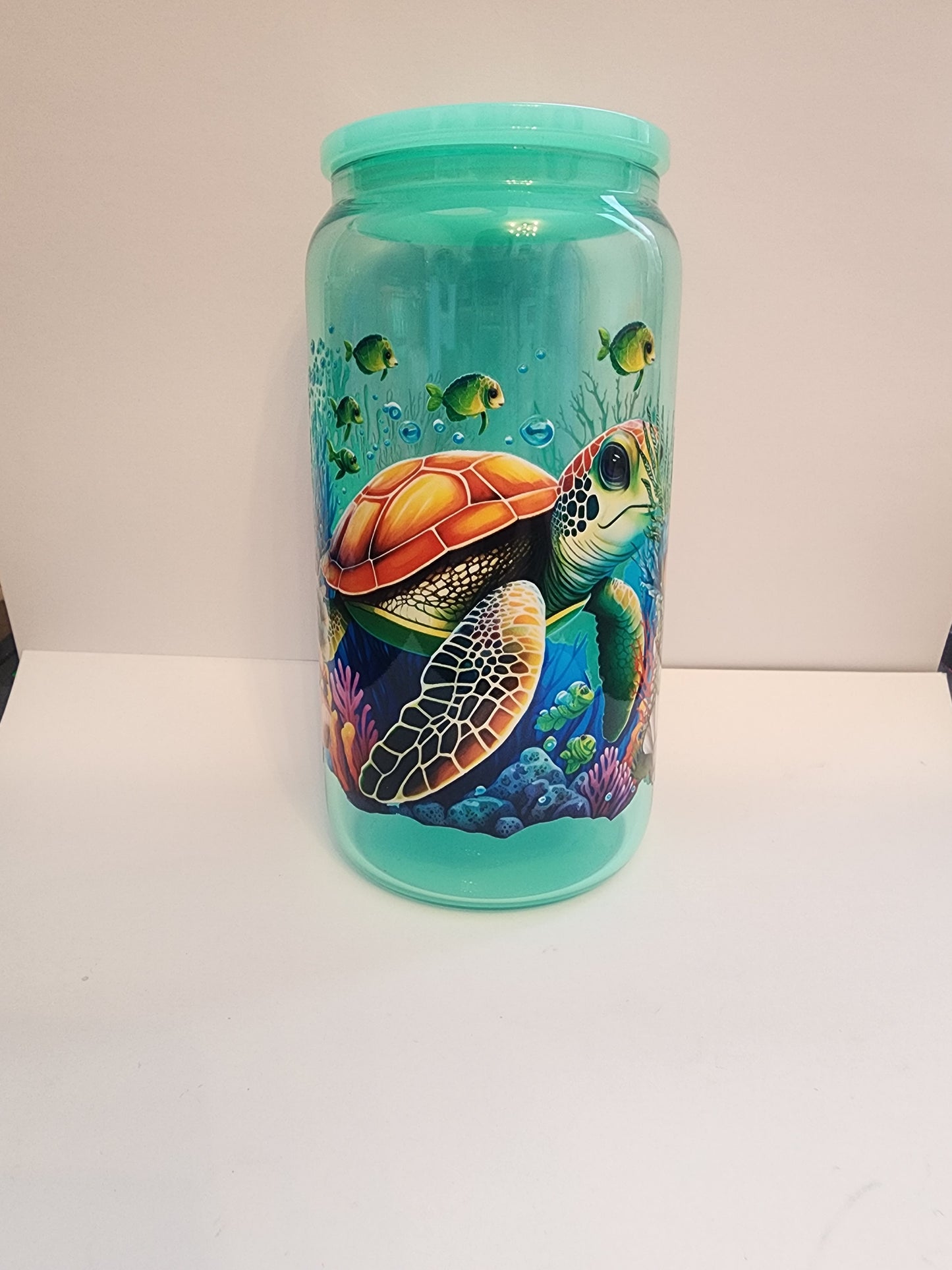 Teal turtle glass cup.