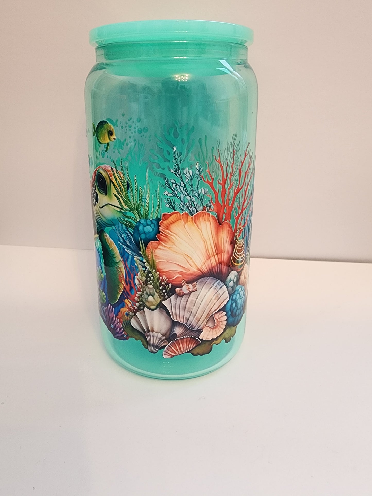 Teal turtle glass cup.